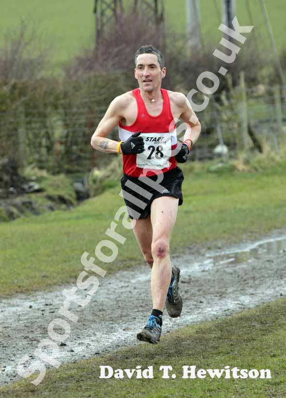 Kerry Liam Wilson (Ron Hill Cumbusland) finishing 3rd and 40-44 winner, males 35 to 64 race, BMAF Cross Country, Herrington, Sunderland.
